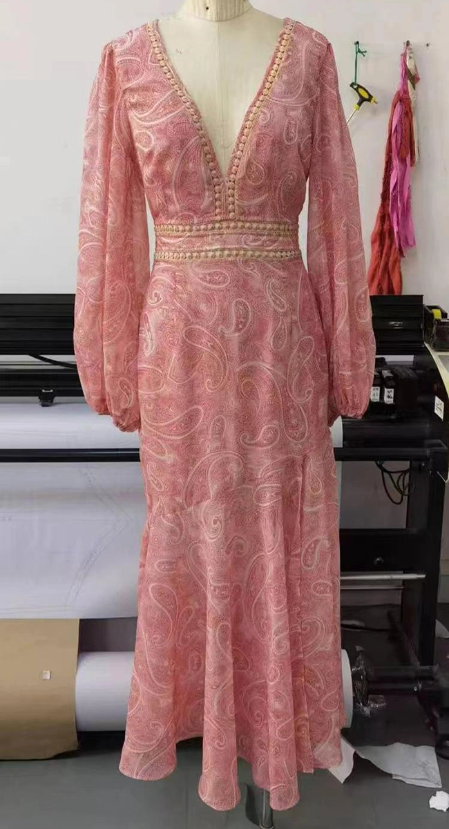 Pink long-sleeve dress sample with decorative trim